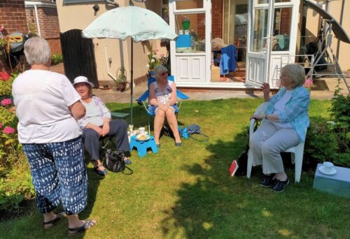 Book club social distancing in the garden in Seaham