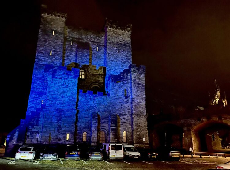 The Vermont Hotel in Newcastle upon Tyne with blue light projected onto the walls